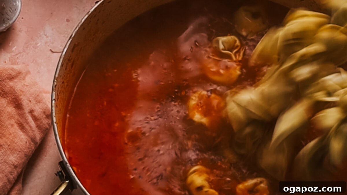 Creamy One-Pot Tortellini Soup 7 Step 4: Tortellini added to the simmering soup in the pot.