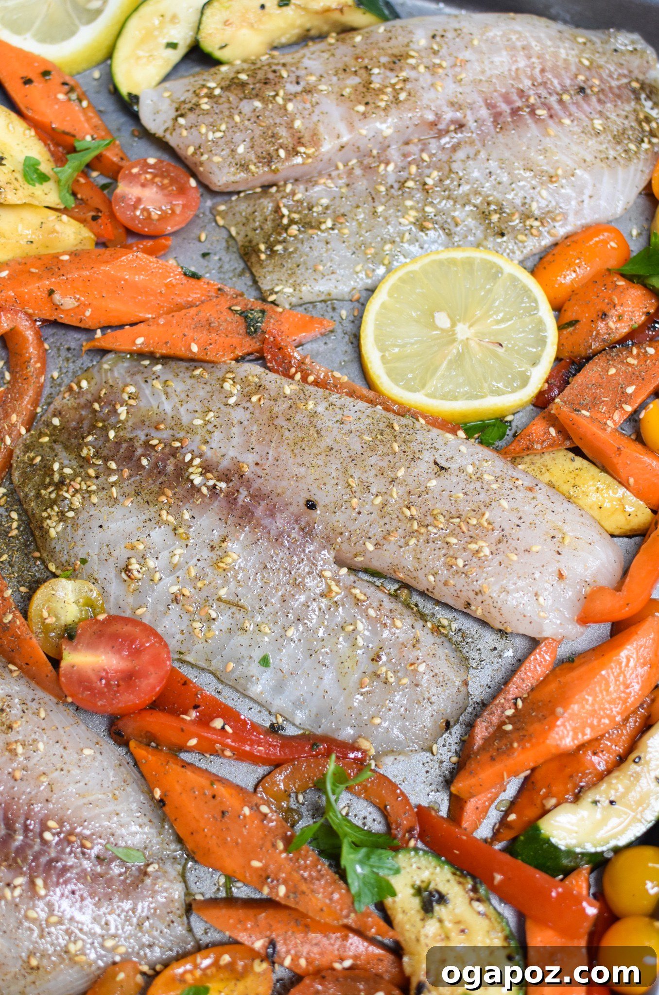 Effortless Mediterranean Baked Tilapia 7 Mediterranean Baked Tilapia Recipe, tilapia and vegetables on baking sheet.