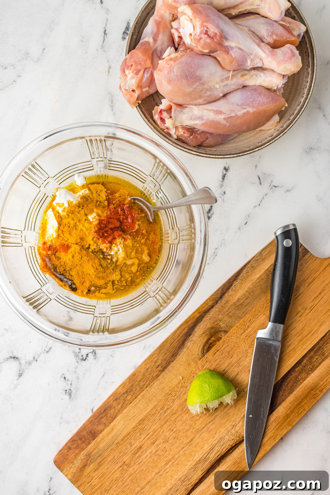 Crispy Air Fryer Tandoori Chicken Drumsticks 6 A mixing bowl filled with the richly colored, thick tandoori marinade, featuring Greek yogurt and a medley of vibrant Indian spices, ready to coat the chicken.