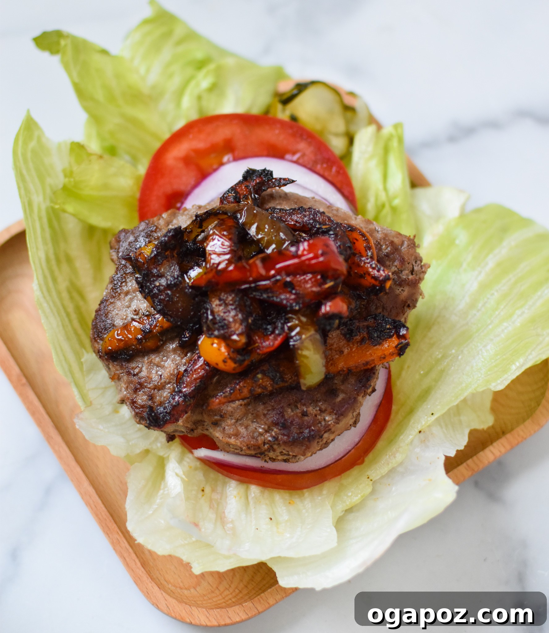 Fiesta Lettuce Burger 6 A delicious Fajita Lettuce Burger presented beautifully on a bed of fresh lettuce, ready to be enjoyed.