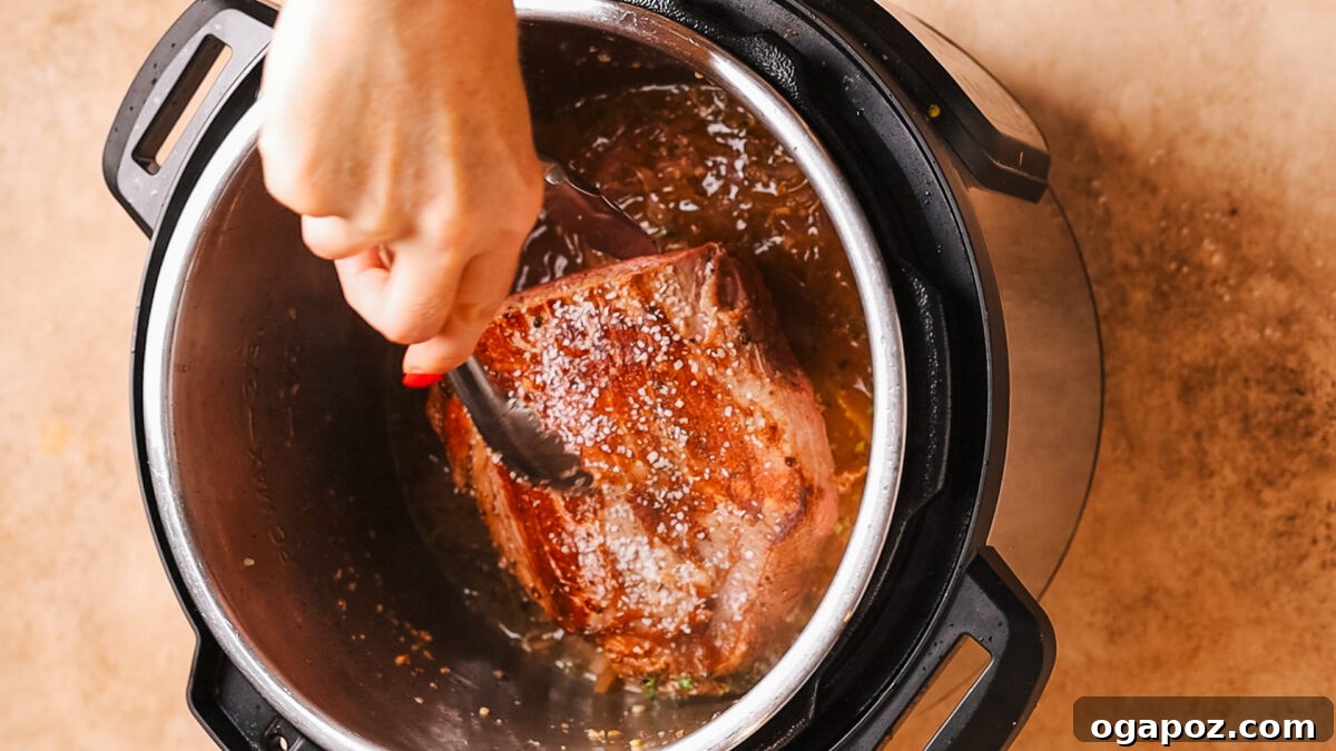 Instant Pot Fall Apart Roast Beef 8 removing roast from pot