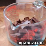 Chopped Dark Chocolate Coarsely chopped dark chocolate pieces, perfectly prepped and ready for melting into a smooth layer