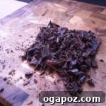 Melted dark chocolate, now smooth and glossy, awaiting its transformation into the first bark layer