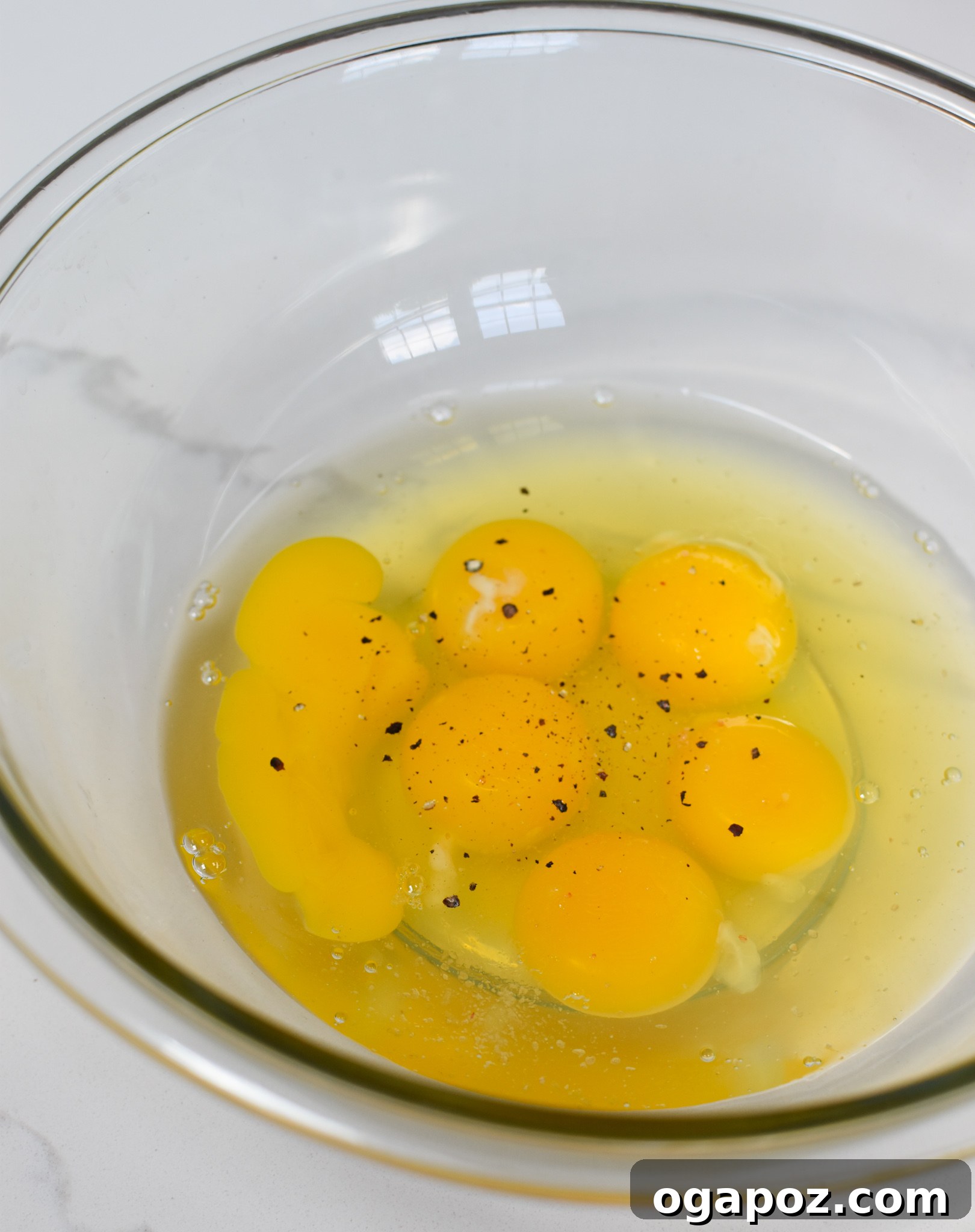 Quick and Easy Chaffles 5 Whisked eggs in a bowl, showing the initial step of the Chaffles Recipe preparation.