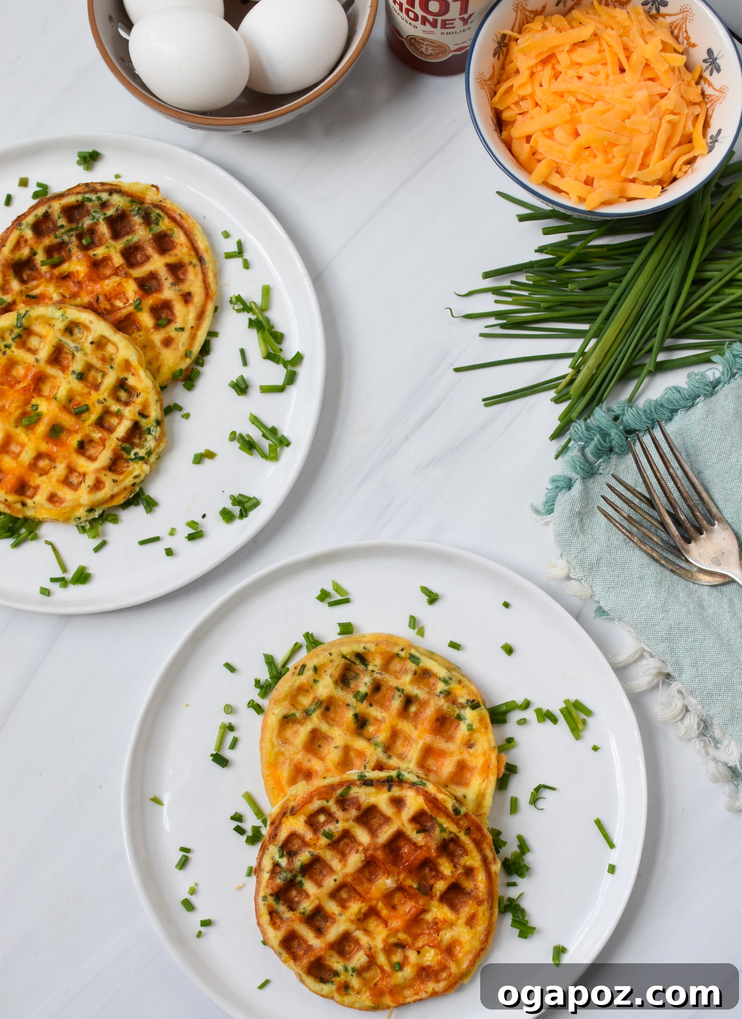 Quick and Easy Chaffles 8 A freshly made Chaffle on a white plate, with a fork, ready to be enjoyed.