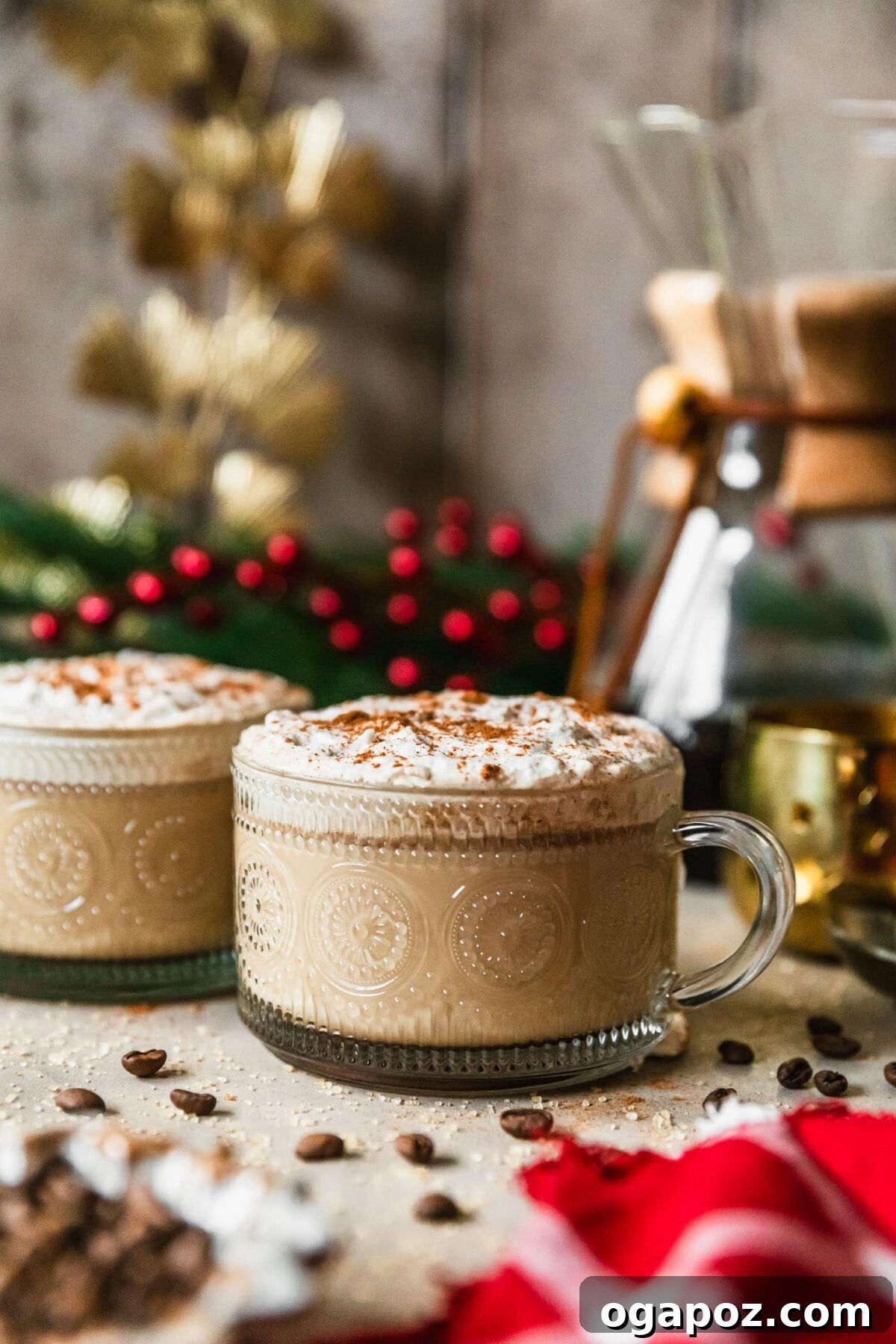 Warm & Festive: 20+ Easy Hot Drinks for a Perfect Christmas 14 Coffee Hot Buttered Rum in a clear mug with a cinnamon stick garnish.