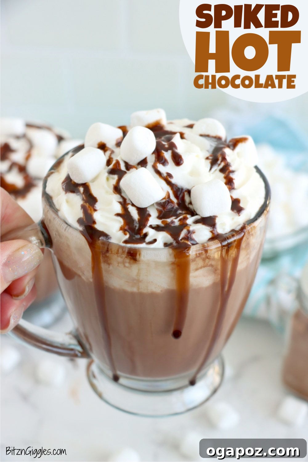 Warm & Festive: 20+ Easy Hot Drinks for a Perfect Christmas 16 Spiked Hot Chocolate in a festive mug, topped with whipped cream and a chocolate drizzle.
