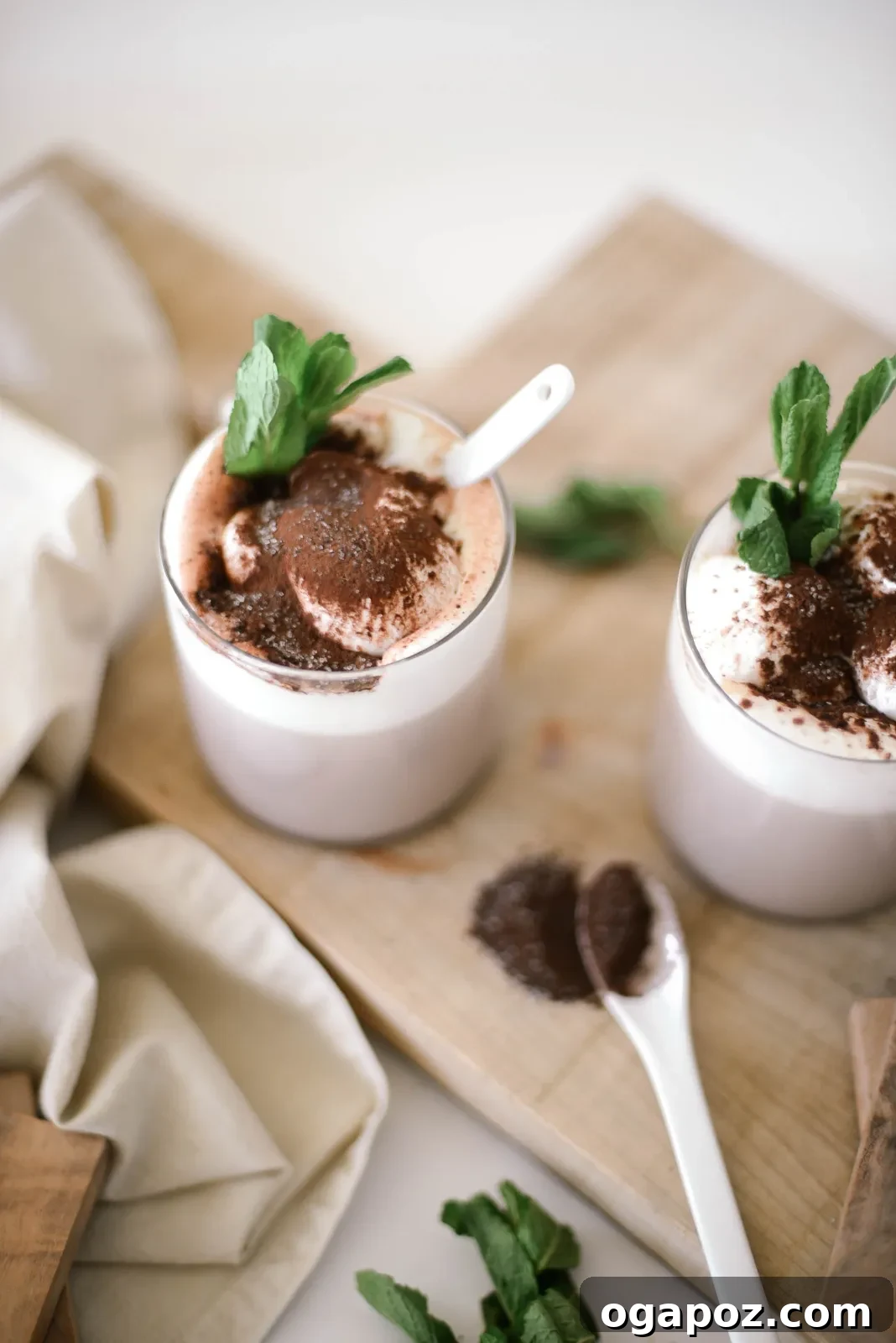 Warm & Festive: 20+ Easy Hot Drinks for a Perfect Christmas 20 Peppermint Mocha Christmas Cocktail in a mug, topped with whipped cream and candy cane pieces.