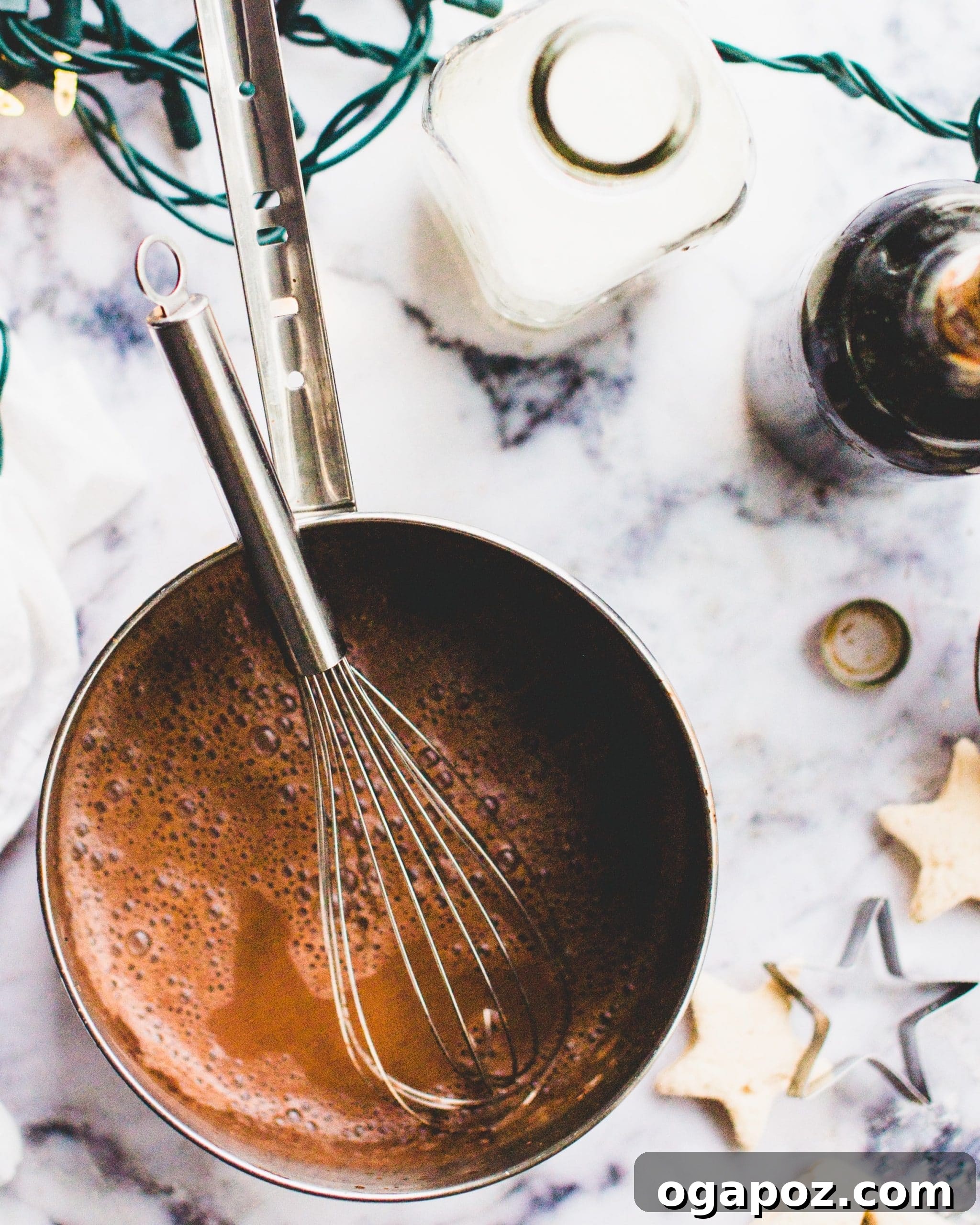 Warm & Festive: 20+ Easy Hot Drinks for a Perfect Christmas 3 Homemade hot chocolate recipe garnished with marshmallows and chocolate shavings.