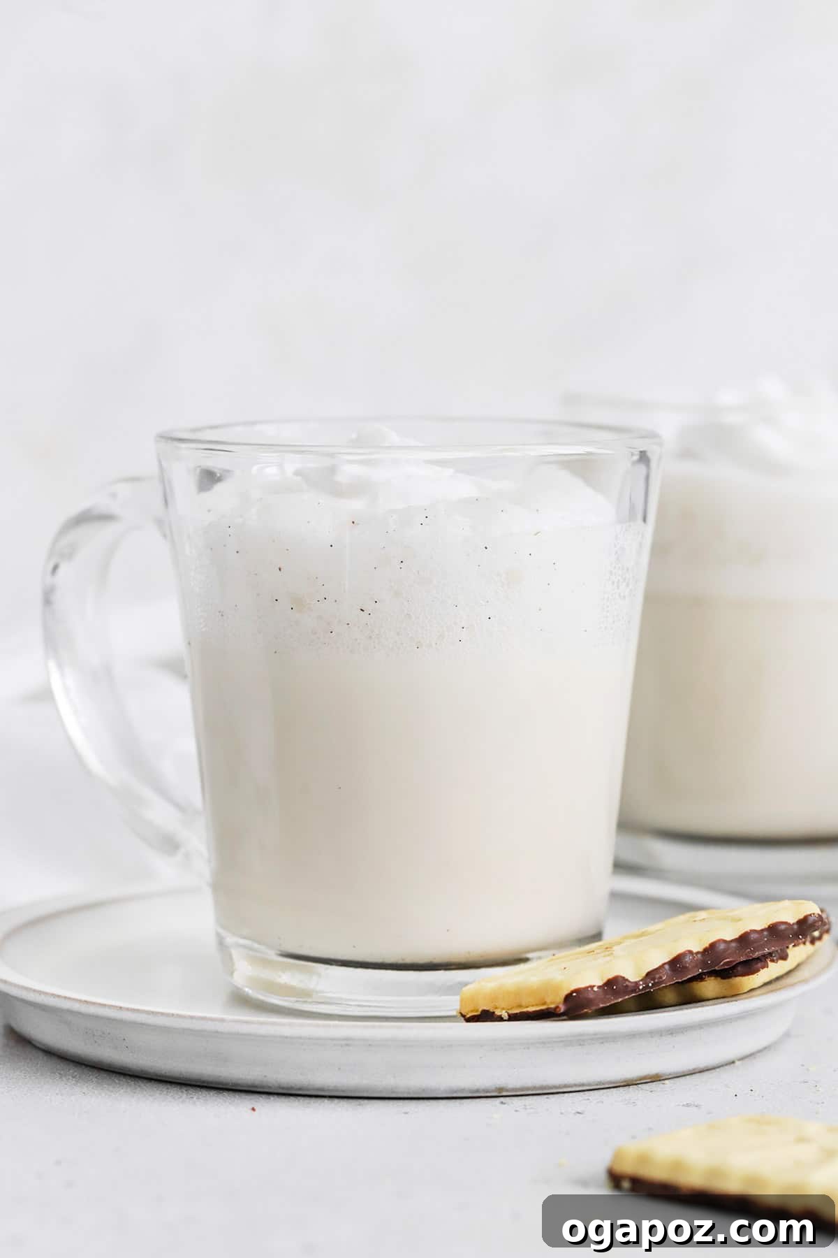 Warm & Festive: 20+ Easy Hot Drinks for a Perfect Christmas 10 Hot Vanilla Steamer in a delicate glass mug, showing its creamy texture.