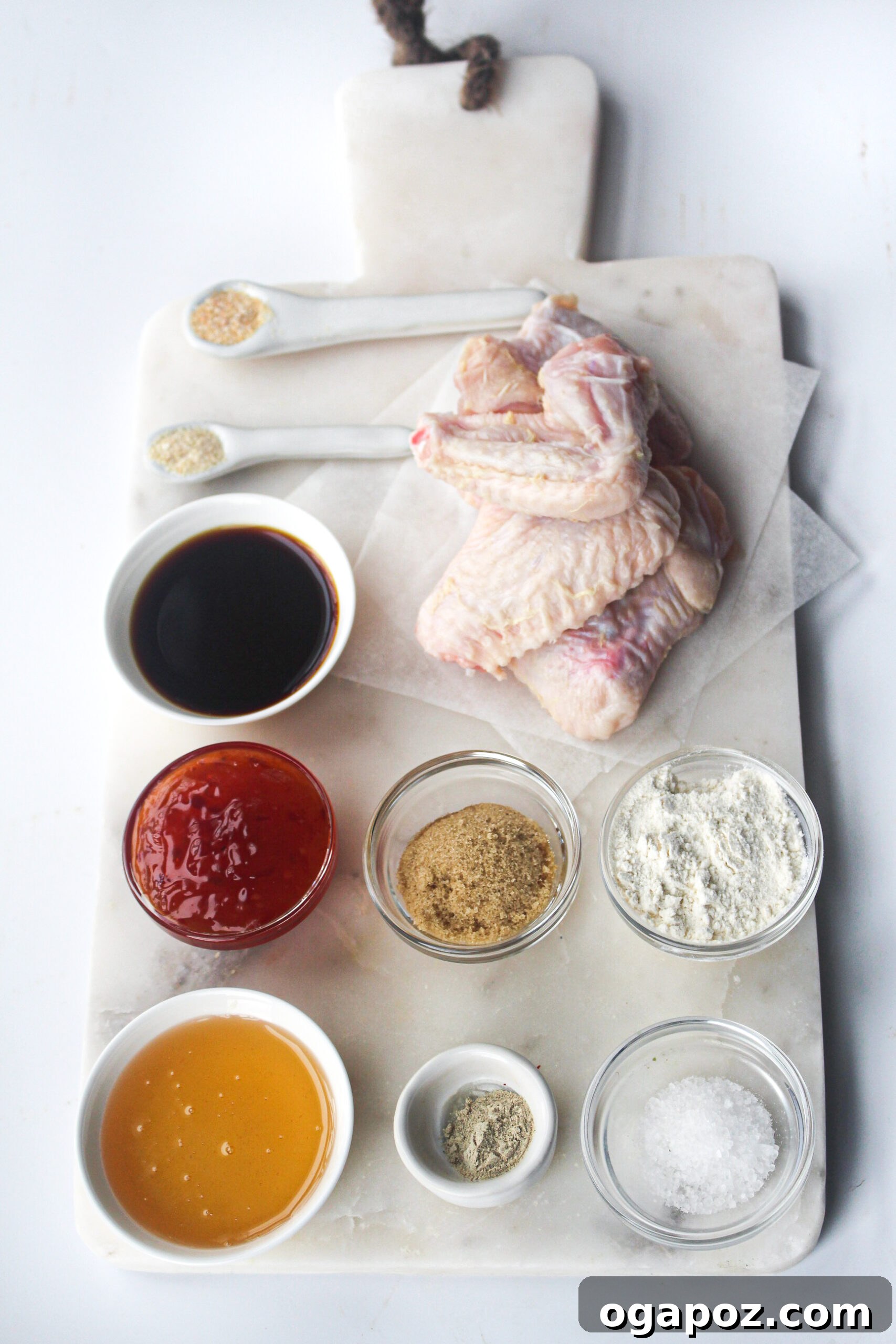 Ingredients for Air Fryer Chicken Wings Recipe laid out on a kitchen counter.