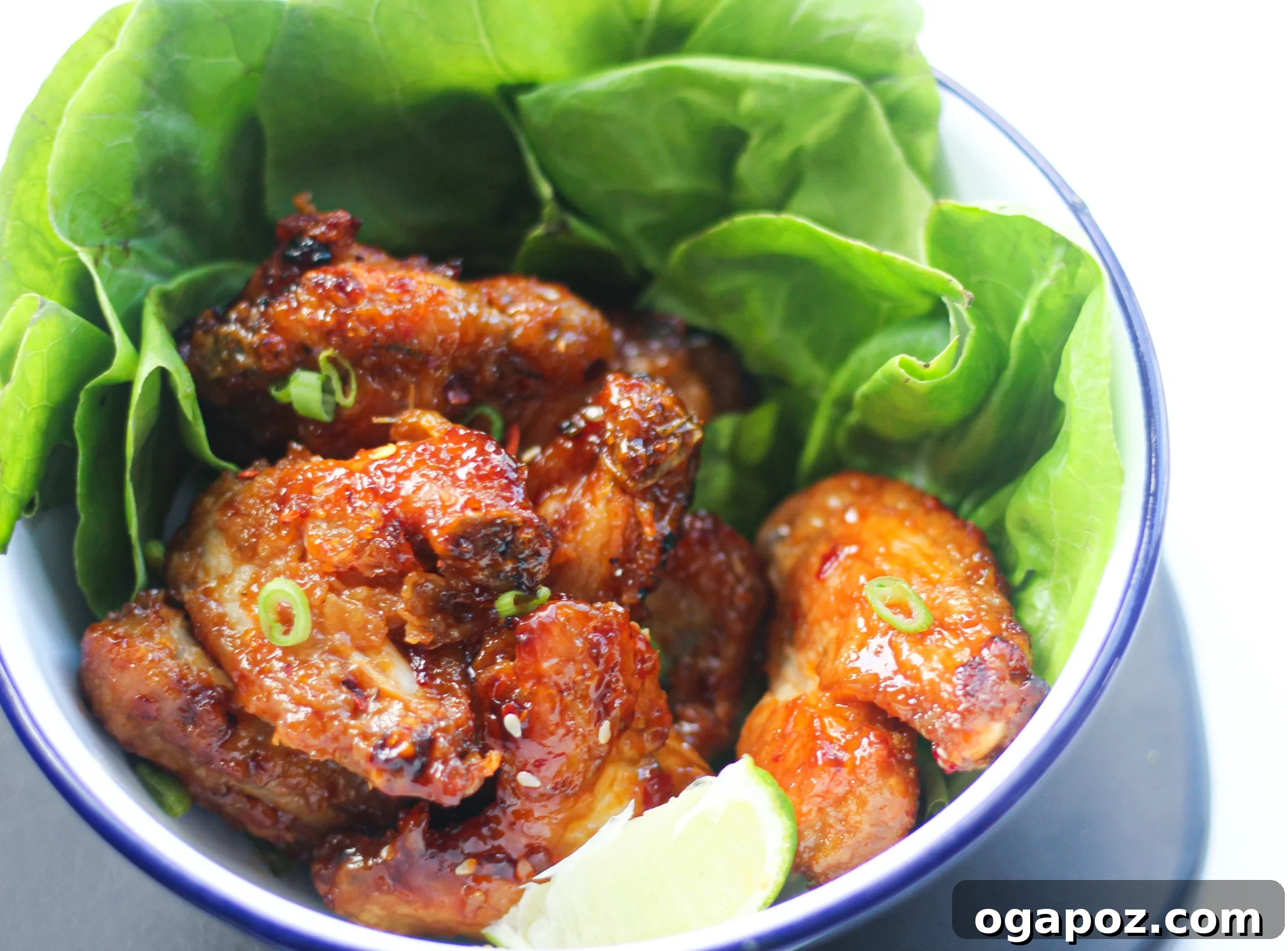 Air Fryer Chicken Wings Recipe served with fresh lettuce leaves.