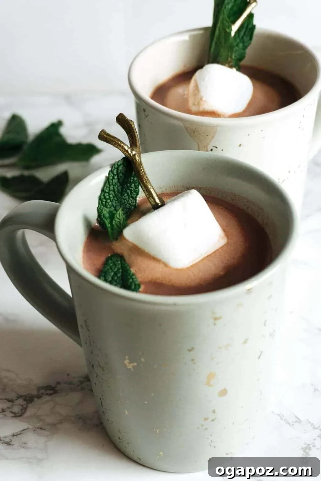 Emerald Elixirs: Creme De Menthe Holiday Cocktails 4 Minty Hot Chocolate, a warm boozy drink with Crème de Menthe and whipped cream.