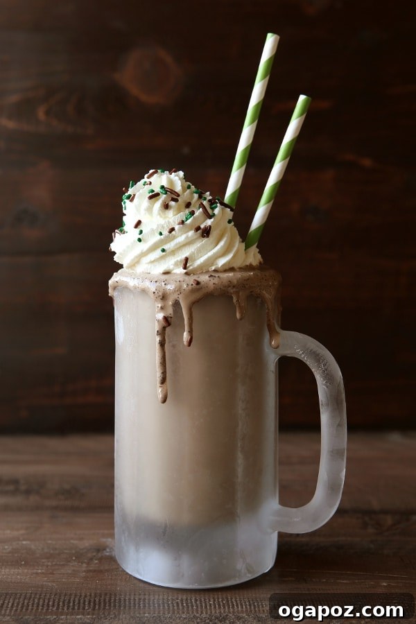 Emerald Elixirs: Creme De Menthe Holiday Cocktails 7 Boozy Mudslide Milkshake with Crème de Menthe, topped with whipped cream and chocolate shavings.