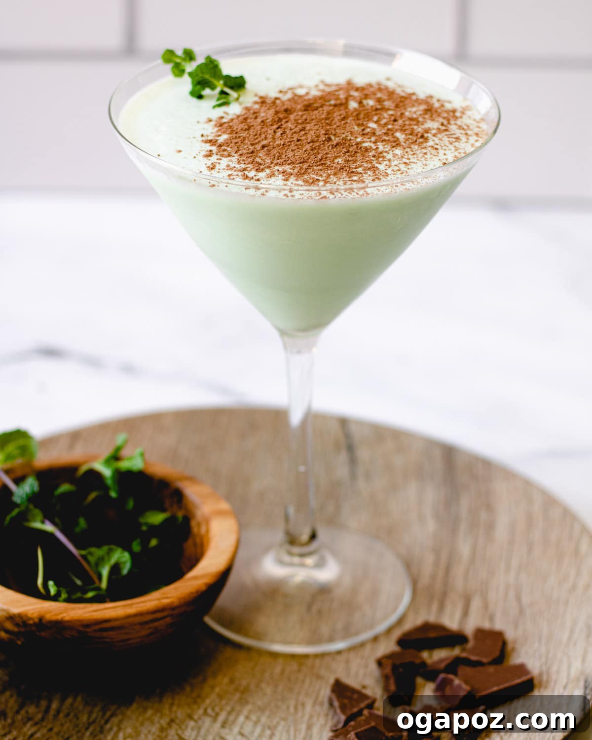 Emerald Elixirs: Creme De Menthe Holiday Cocktails 9 Frozen Mint Brandy Alexander, a frosty and indulgent dessert cocktail.