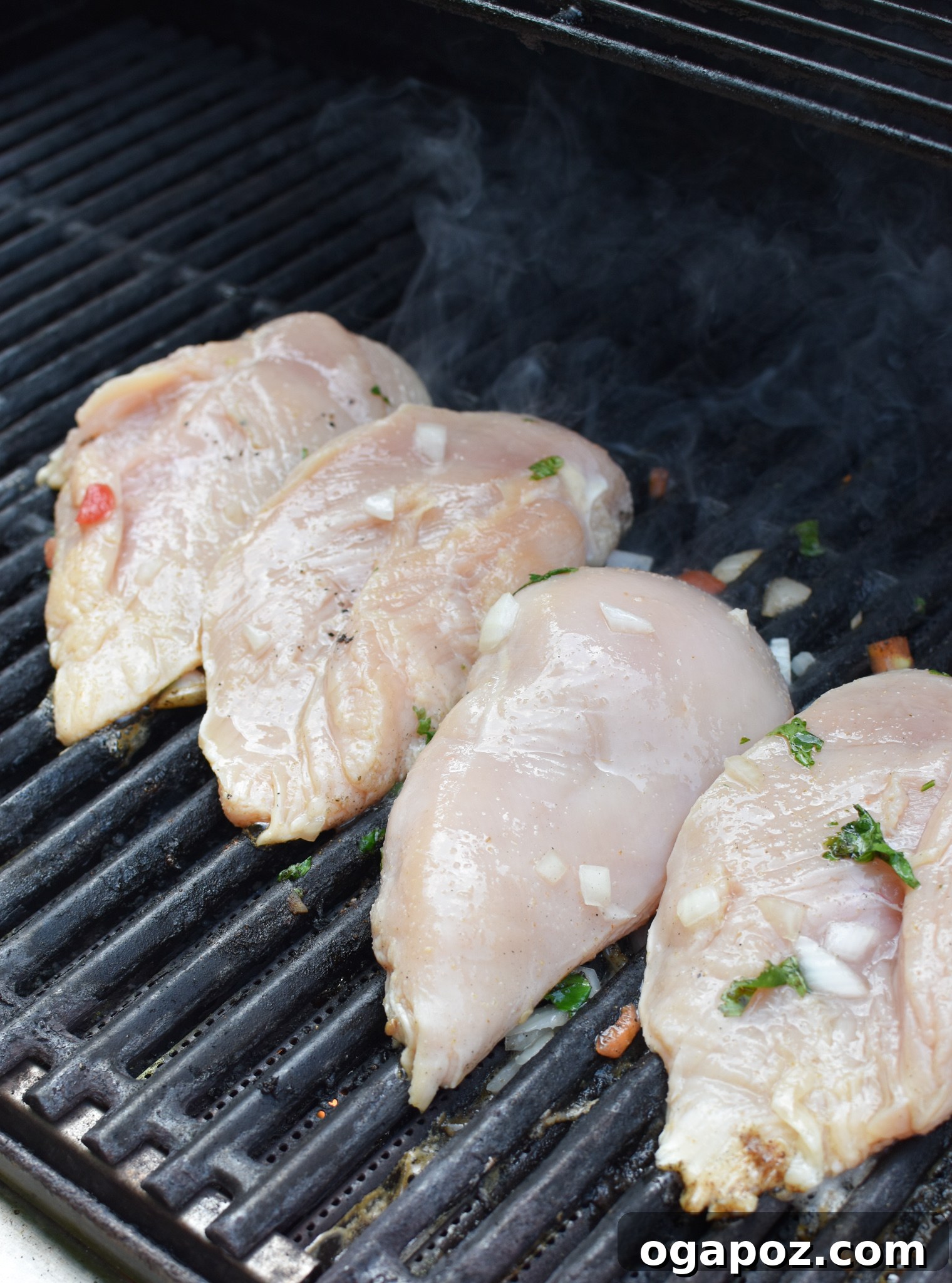 Citrus Margarita Grilled Chicken 6 Margarita Grilled Chicken cooking on an outdoor grill, with beautiful char marks forming.