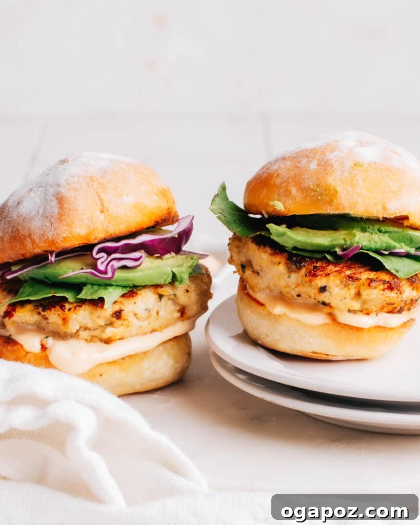 28 Healthy Chicken Recipes Easy Delicious Dietitian Approved 7 Juicy Ground Chicken Burger on a bun with fresh toppings and a side salad