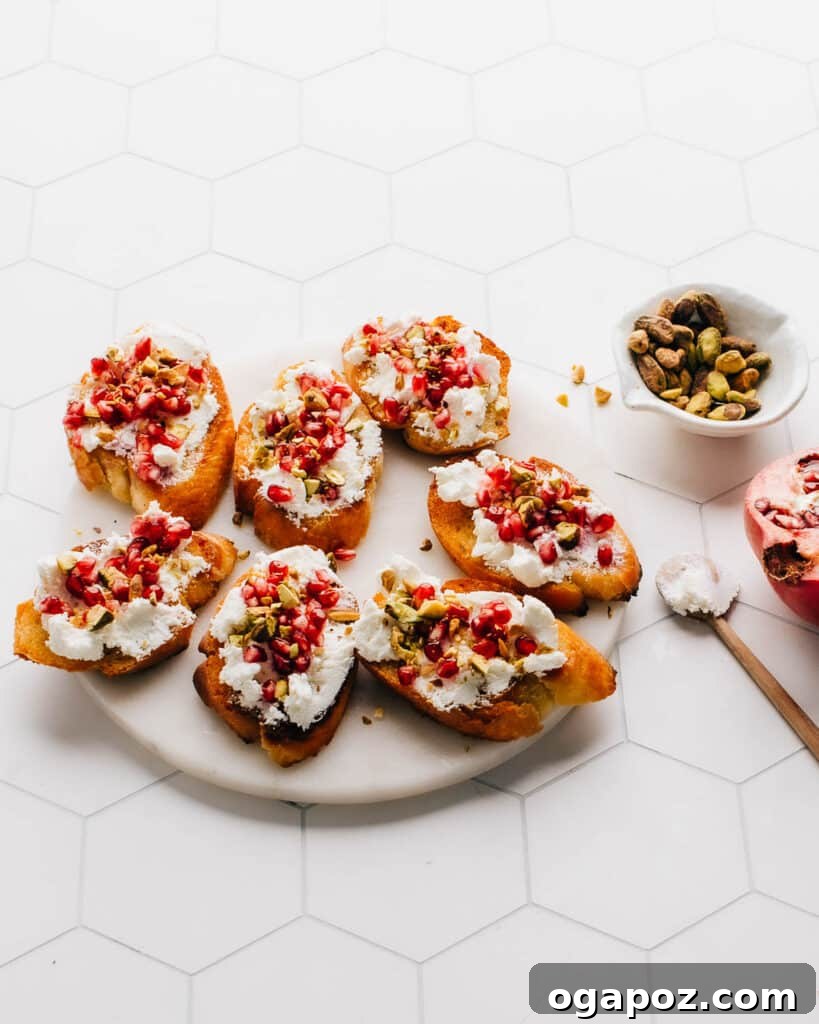 Simple Christmas Bites Everyone Craves 9 Goat Cheese appetizer with pomegranate and pistachios.