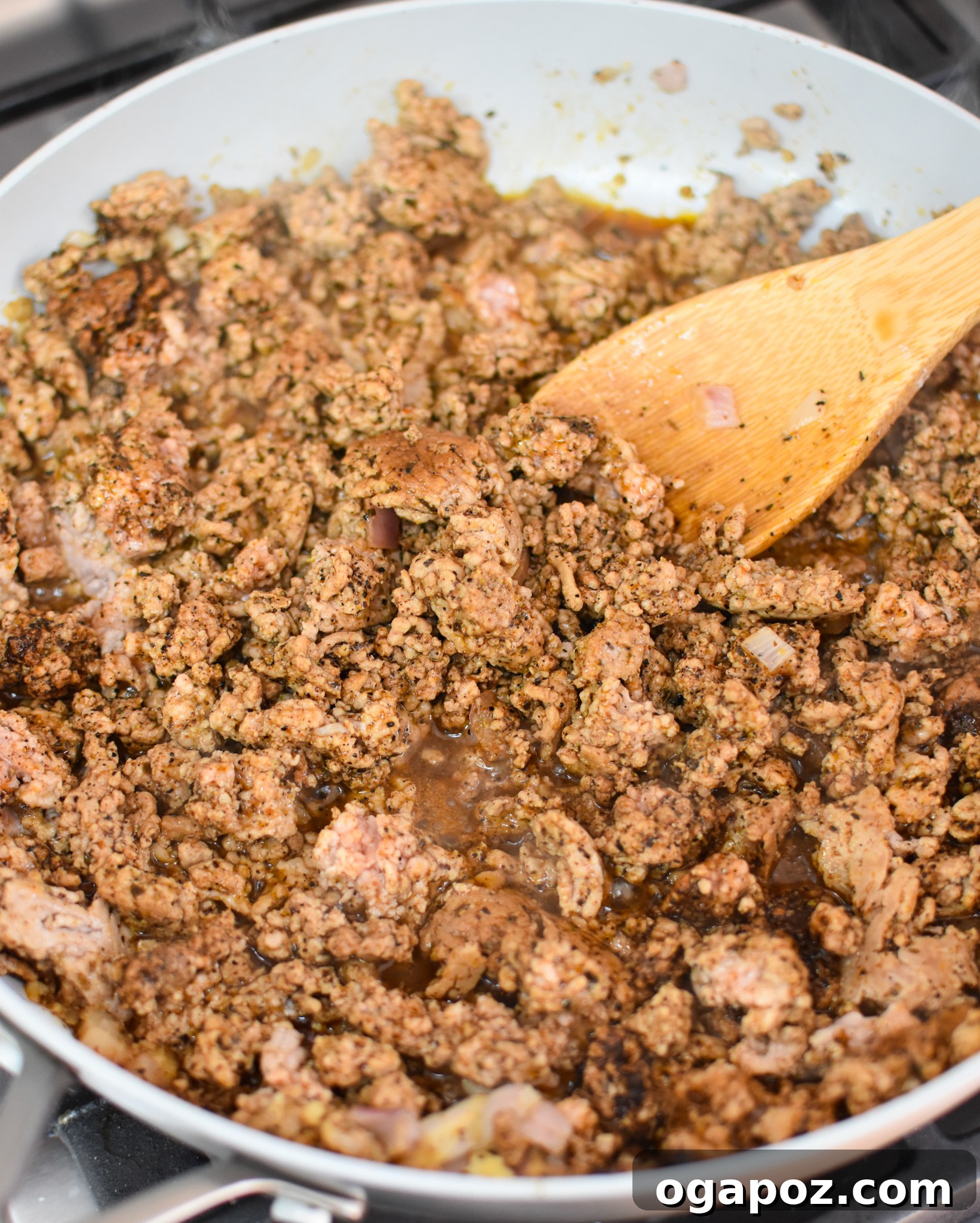 Crispy Air Fryer Pork Taquitos 5 Ground pork mixture for taquitos cooking in a skillet with spices and salsa, ready to be filled.