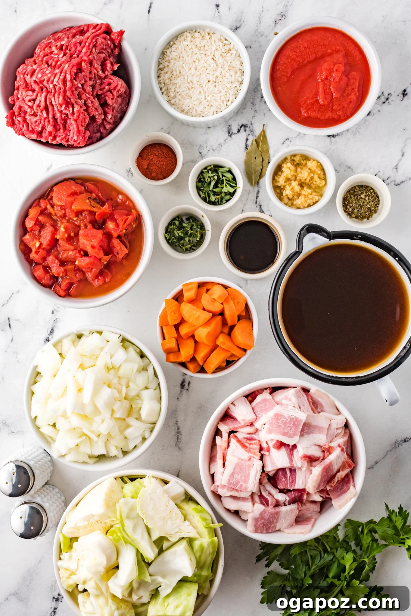 Unstuffed Cabbage Soup 3 Arrangement of Cabbage Roll Soup ingredients, including fresh vegetables, spices, and meats.