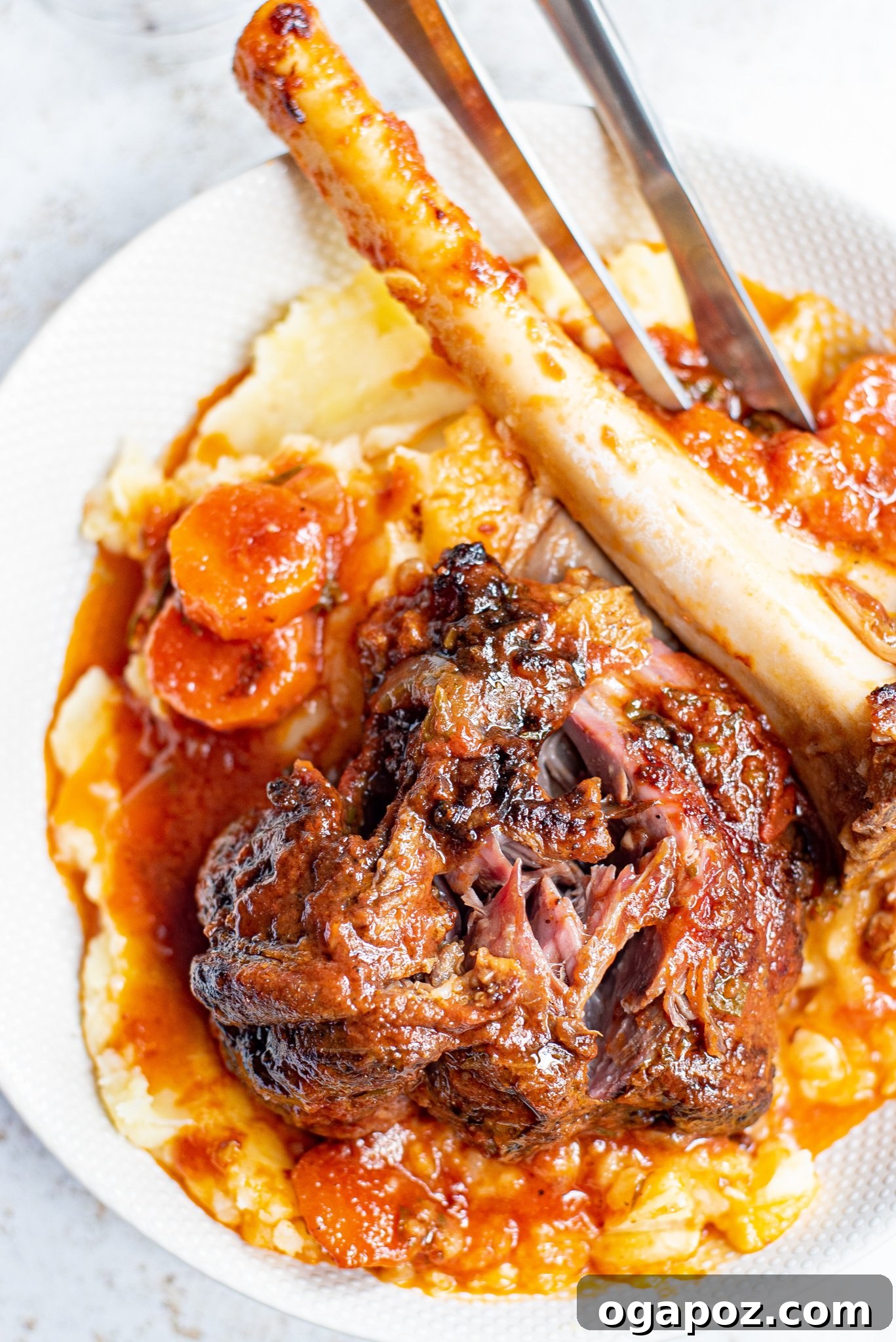 Fall-Off-The-Bone Braised Lamb Shanks 9 Braised Lamb Shanks Recipe: close-up of tender lamb falling off the bone.