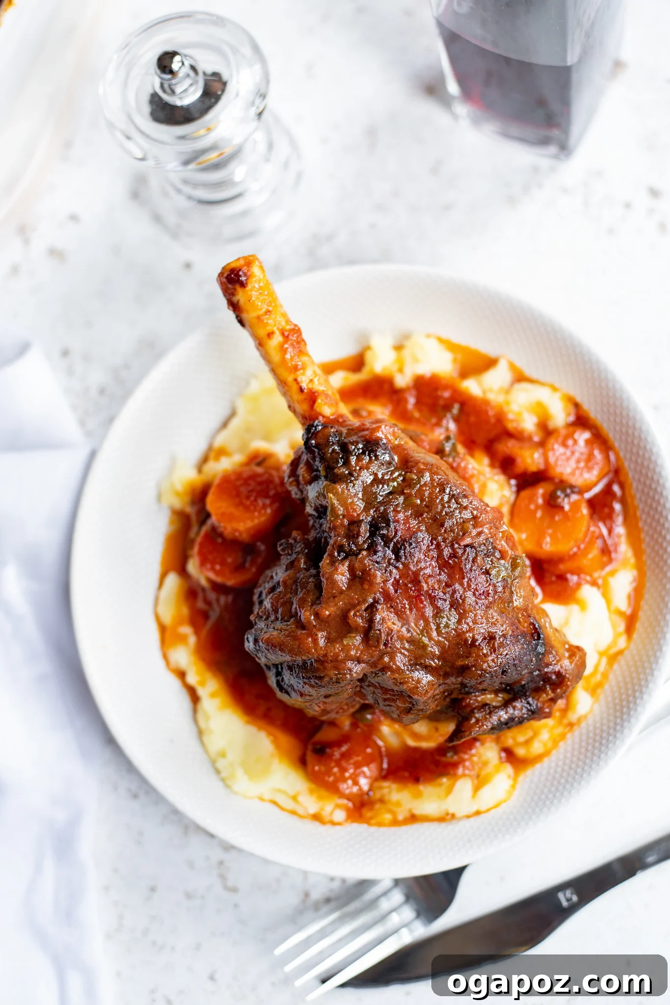 Fall-Off-The-Bone Braised Lamb Shanks 10 Braised Lamb Shanks Recipe served over creamy mashed potatoes.