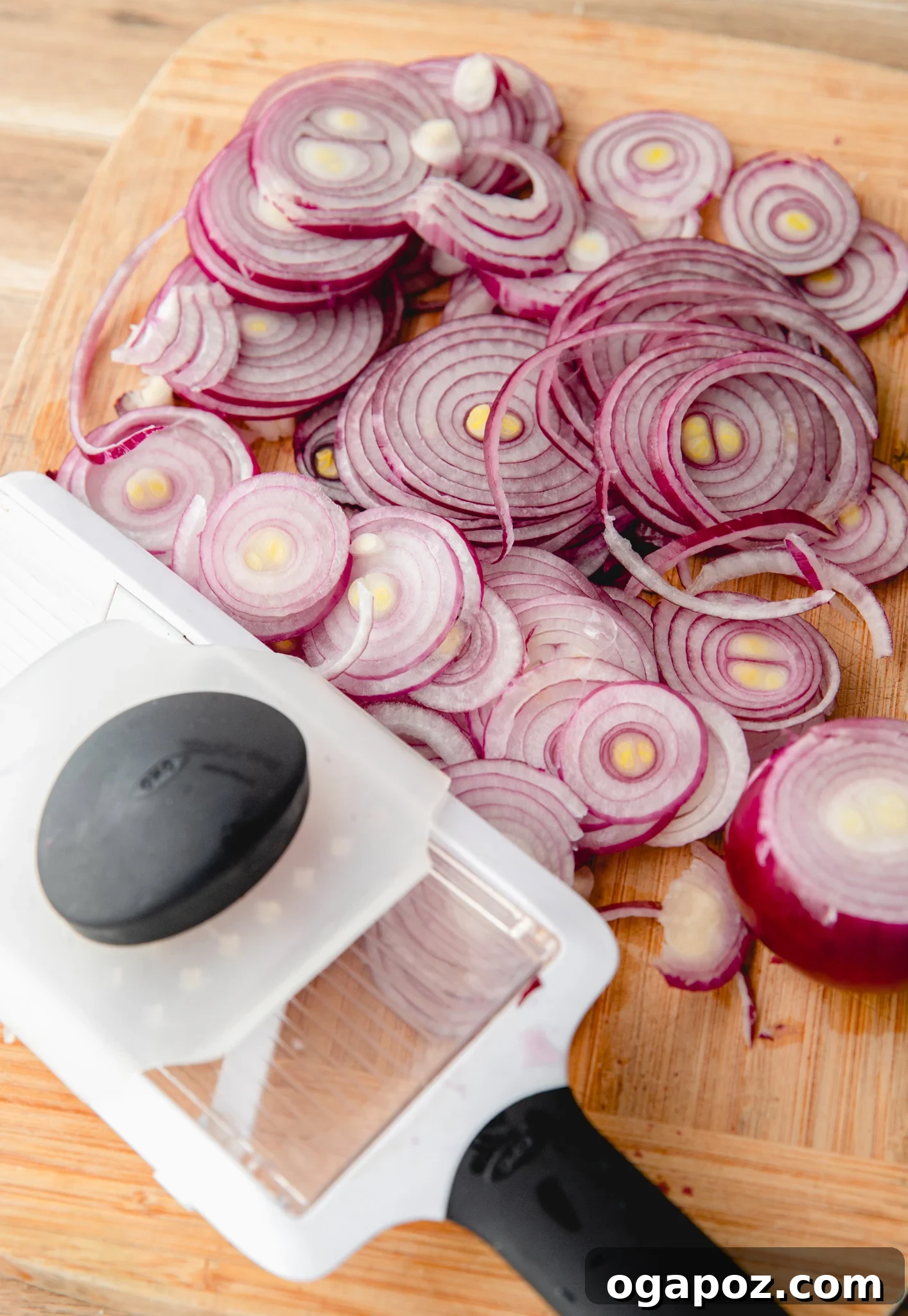 Blush Hour Onions 5 Slicing red onions with a mandoline for pickling.