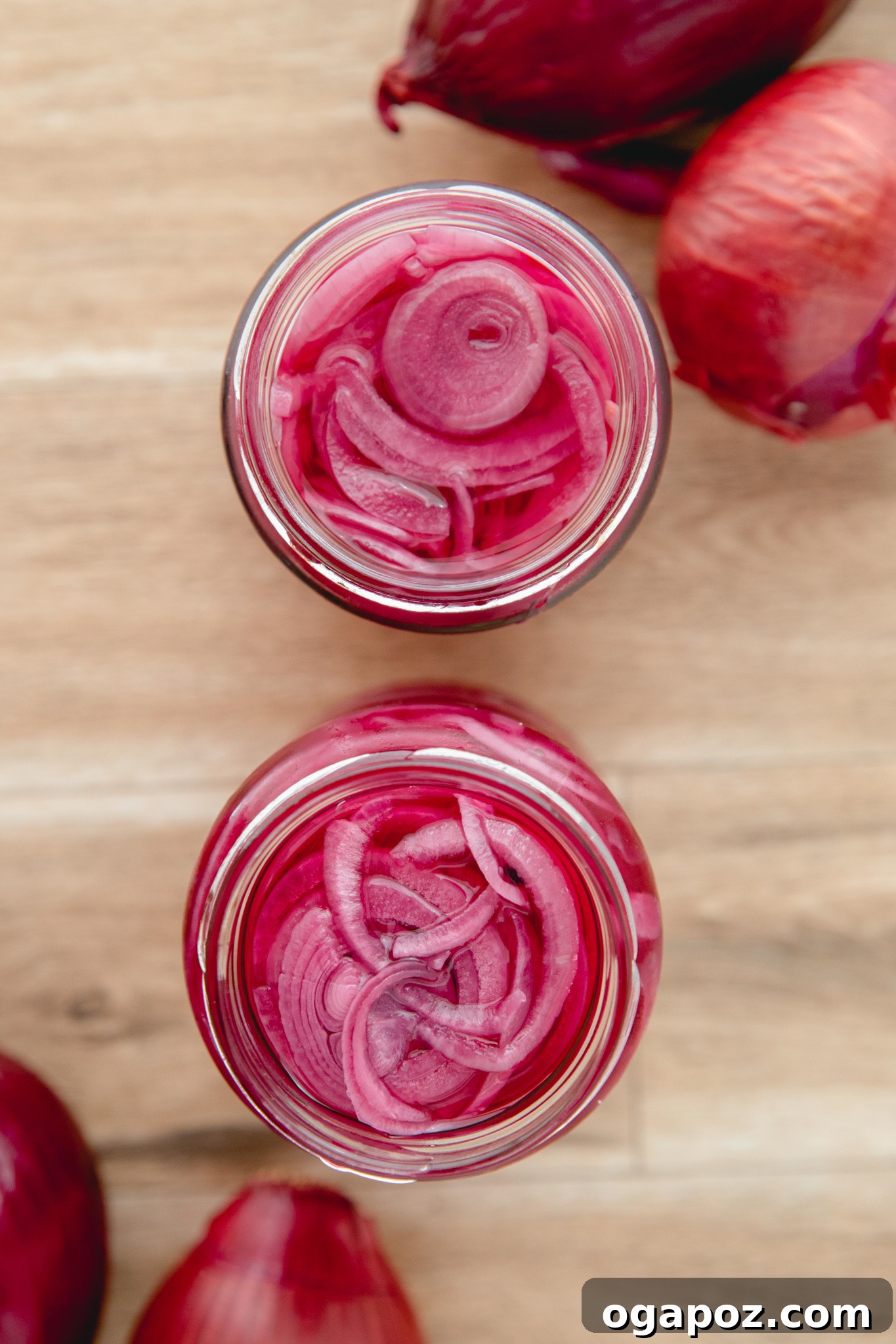 Blush Hour Onions 8 A jar of Quick Pickled Red Onions, showcasing their vibrant color.