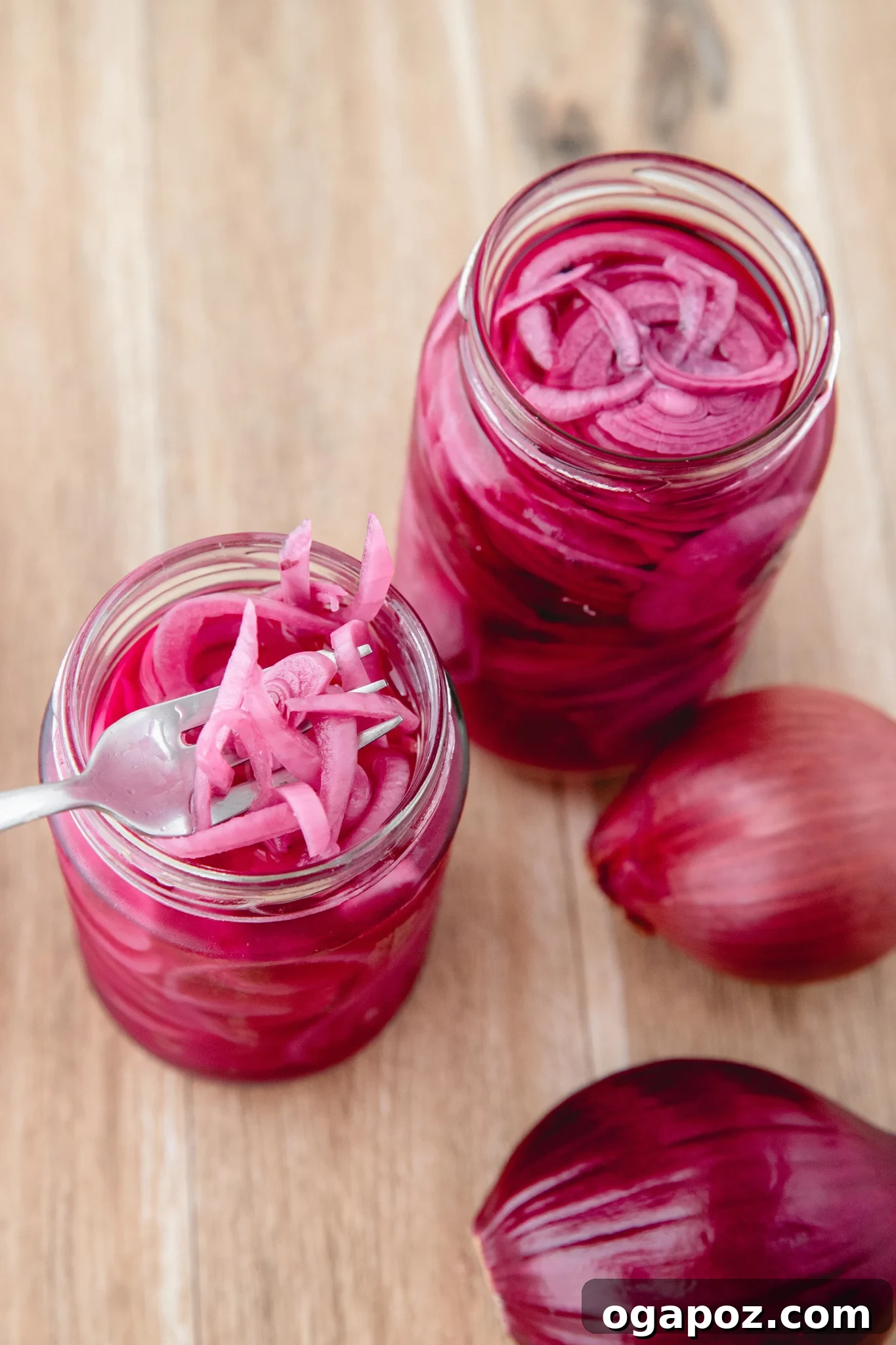 Blush Hour Onions 9 A fork piercing a Quick Pickled Red Onion slice, ready to be eaten.