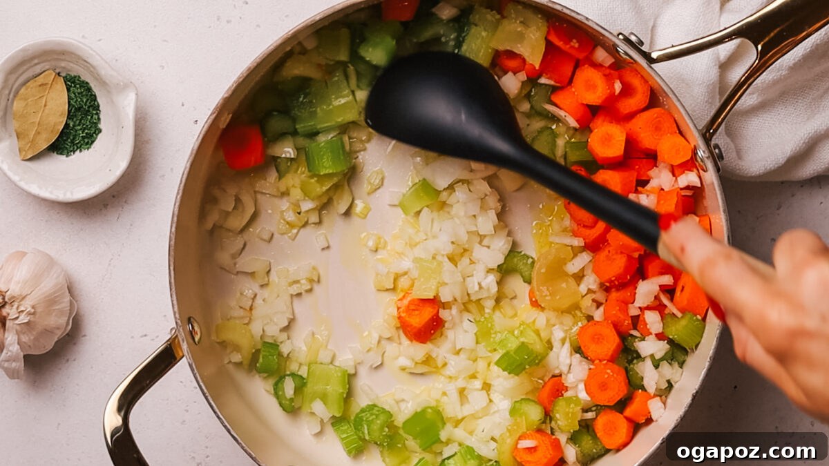 Deliciously Simple Ham Bone Soup Hearty and Flavorful 4 Step 1: Sautéing diced onions, carrots, and celery in a large pot with olive oil.