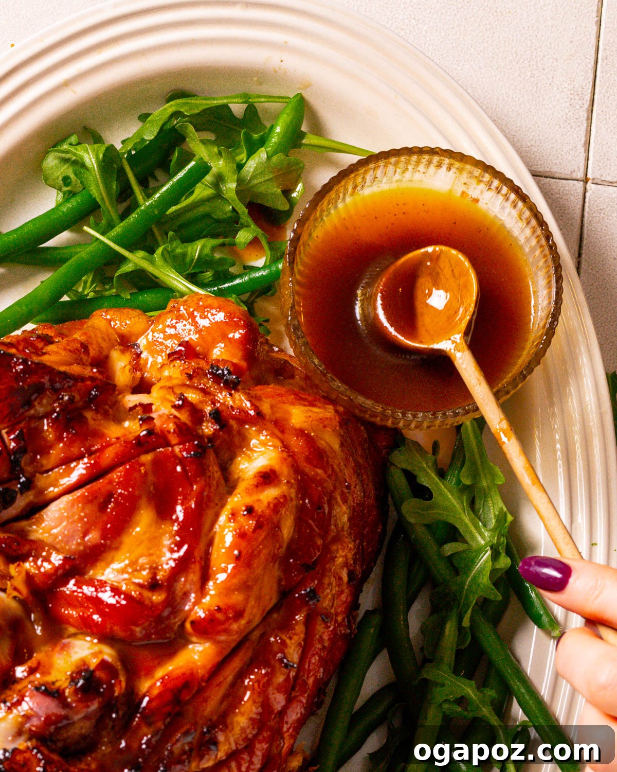 The Perfect Ham Glaze 2 Glaze for ham next to a finished slow cooker ham recipe, showcasing a beautifully caramelized and glossy appearance.
