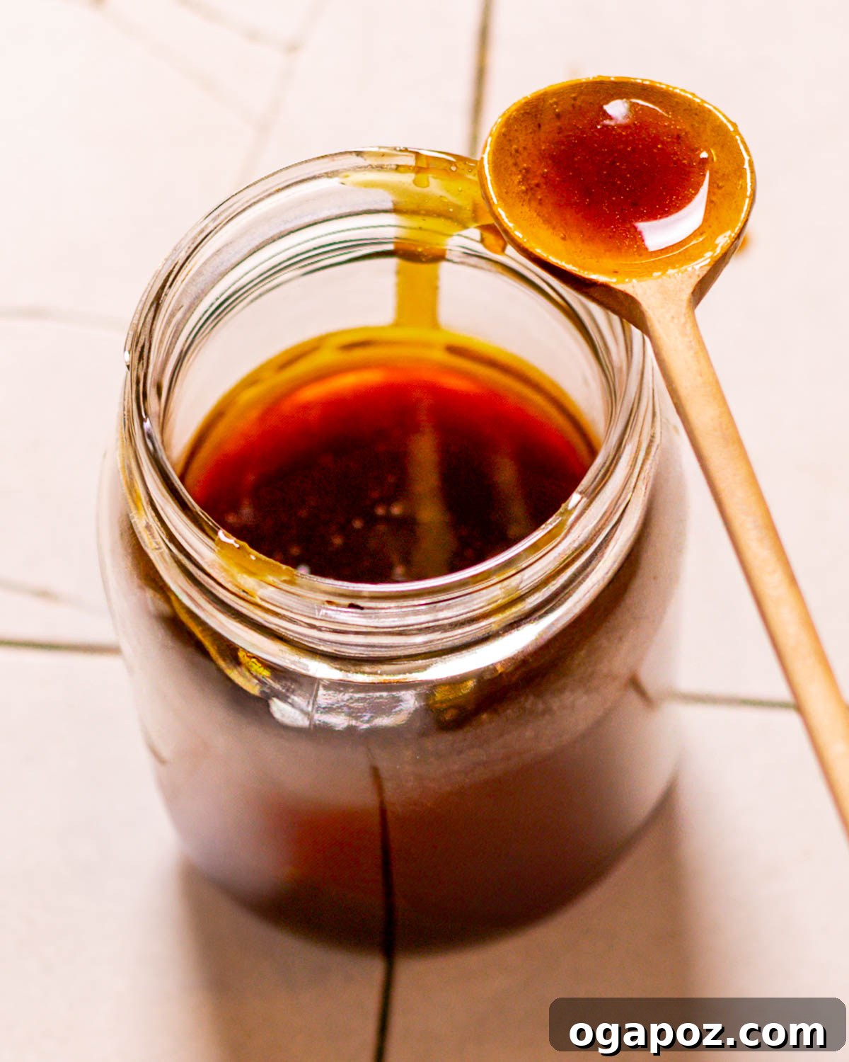 The Perfect Ham Glaze 8 Storing homemade ham glaze in a glass jar, demonstrating make-ahead convenience.