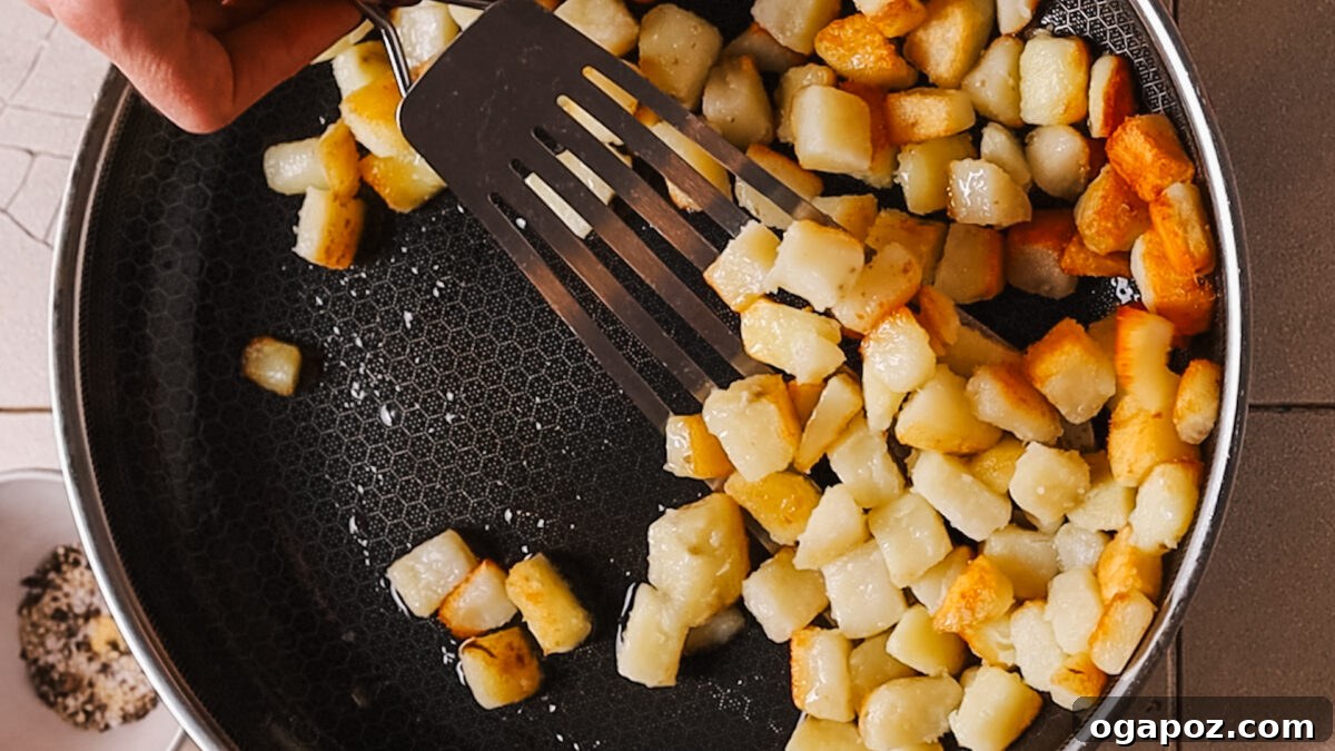 Crispy Fluffy French Fries 7 Sautéing potatoes in a pan