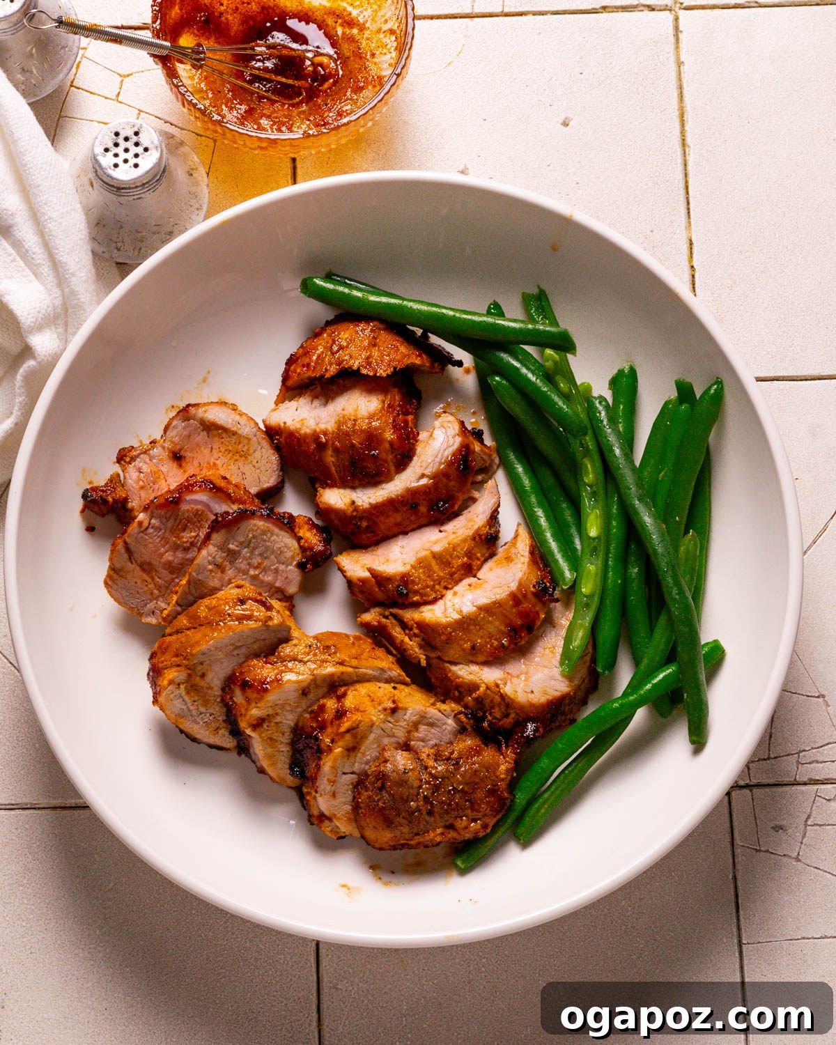 Succulent Air Fried Pork Tenderloin 11 Close-up of perfectly cooked Air Fryer Pork Tenderloin slices, glistening with juices, ready to be served.