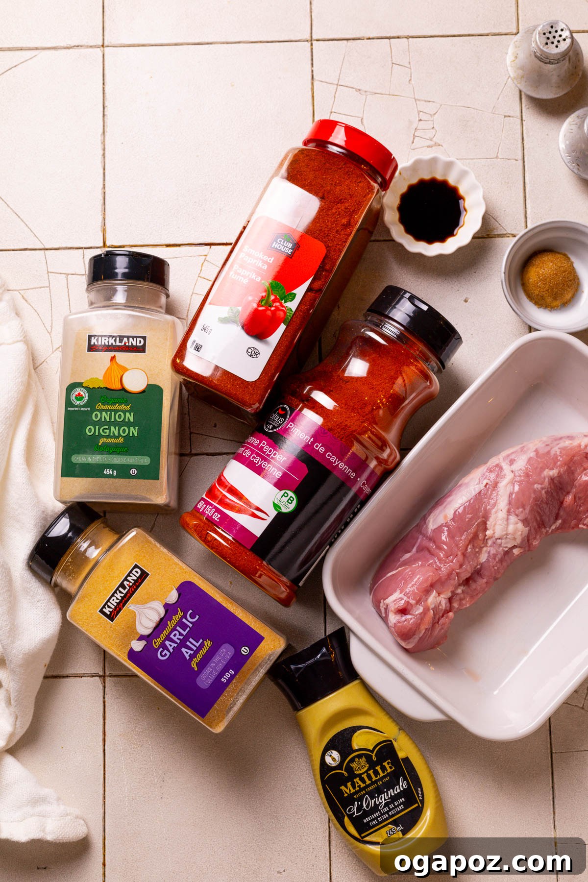 Succulent Air Fried Pork Tenderloin 3 Raw pork tenderloin alongside various marinade ingredients like olive oil, soy sauce, Dijon mustard, brown sugar, and spices.
