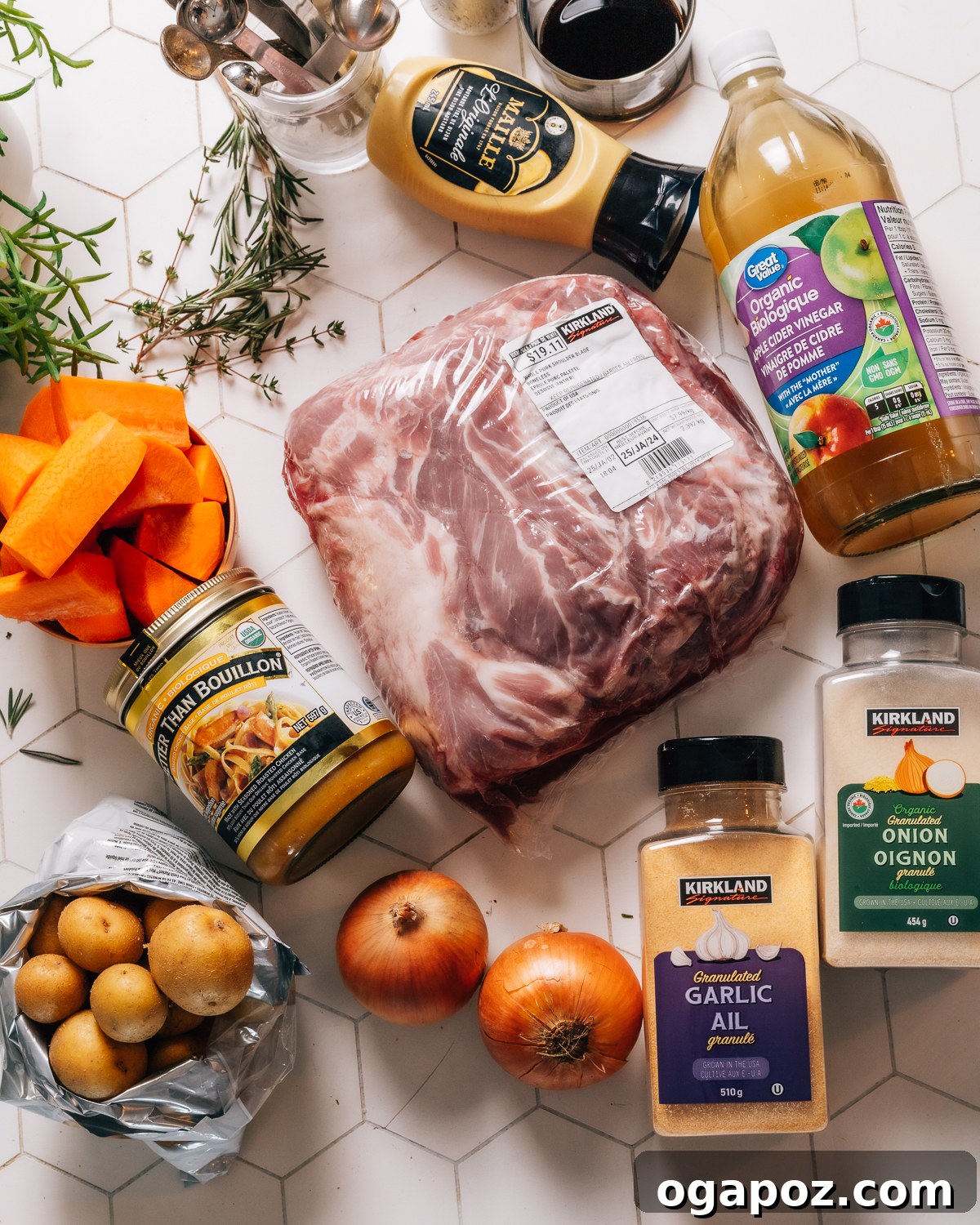 Melt in Your Mouth Slow Cooked Pork Shoulder 3 Pork Shoulder ingredients laid out on a table, including spices, vegetables, and liquids.