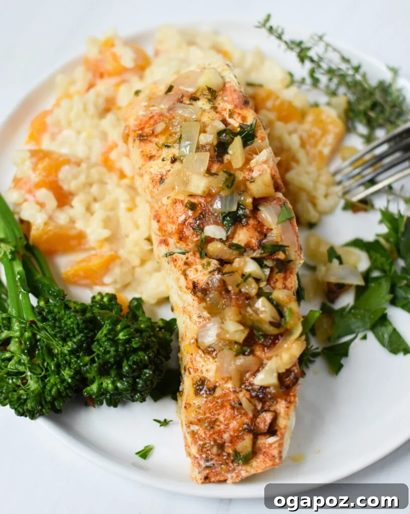 Zesty Lemon Garlic Halibut 2 Exquisite Lemon Garlic Halibut Recipe served with creamy butternut squash risotto, garnished with fresh parsley and lemon slices.