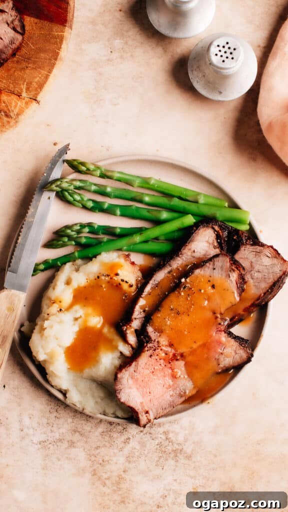 Mouthwatering Boneless Beef Ideas 14 Air Fryer Roast Beef in Plate, perfectly cooked and sliced.