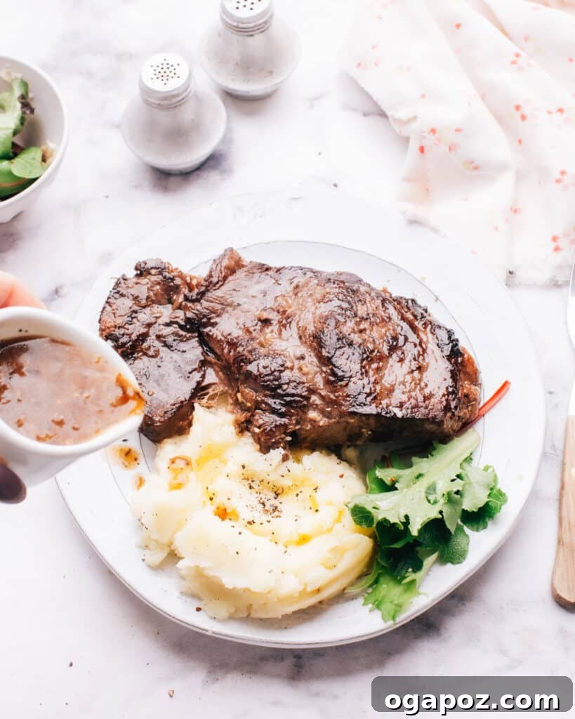 Mouthwatering Boneless Beef Ideas 5 Pouring rich gravy onto Instant Pot steak, served alongside vegetables.