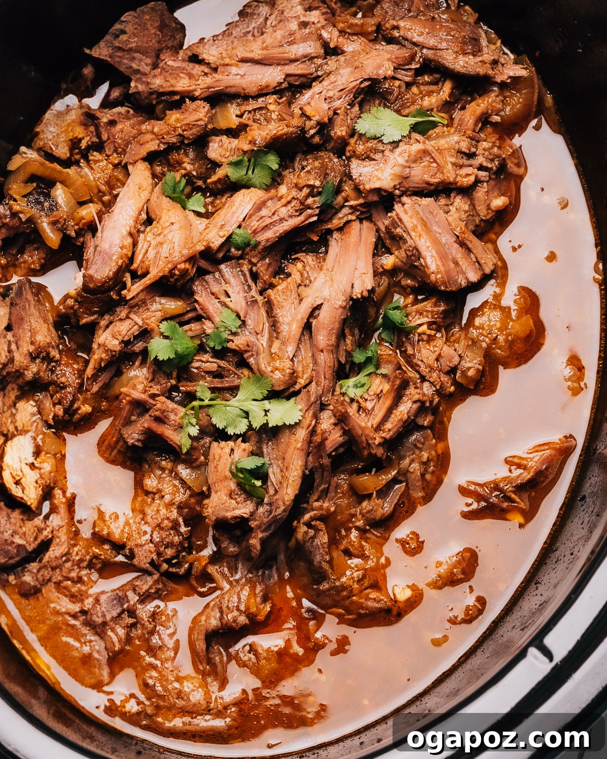 Mouthwatering Boneless Beef Ideas 8 Shredded beef recipe in a crock pot, ready for various meals.