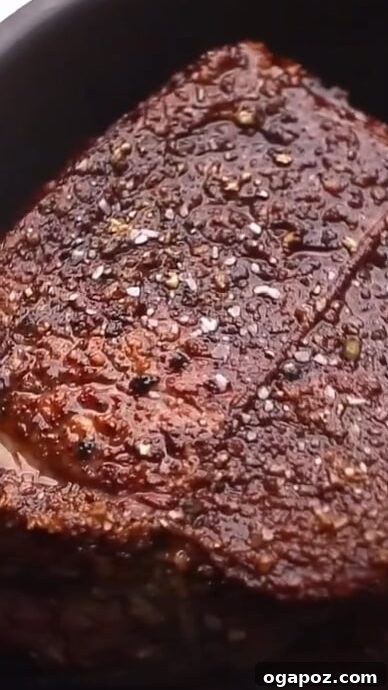 Slow-Braised Dutch Oven Beef 5 Searing beef roast in a Dutch oven until golden brown.