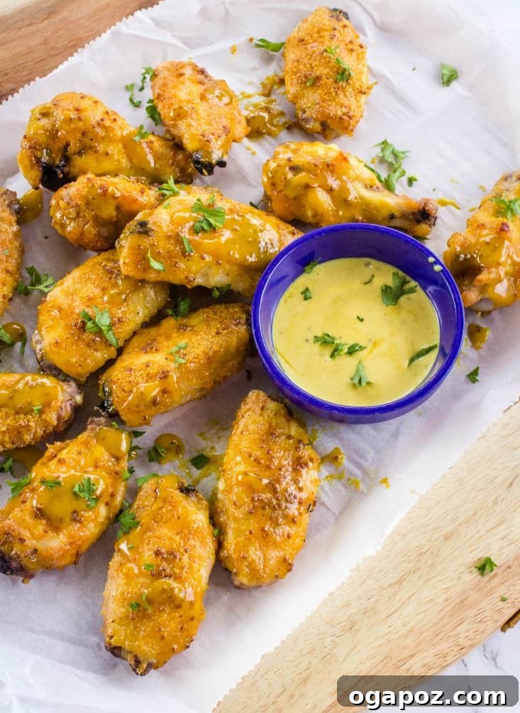 The Ultimate Chicken Wing Sauce Collection 11 Honey Mustard Wing Sauce in a small white bowl.