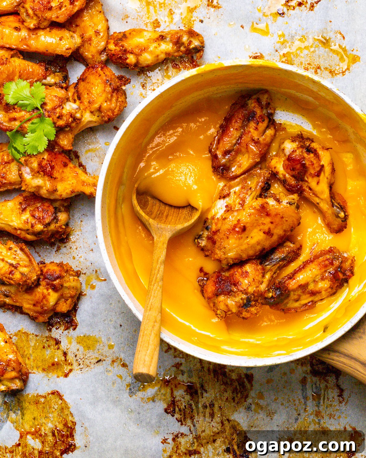 The Ultimate Chicken Wing Sauce Collection 4 Mango Habanero Wings garnished with fresh cilantro.