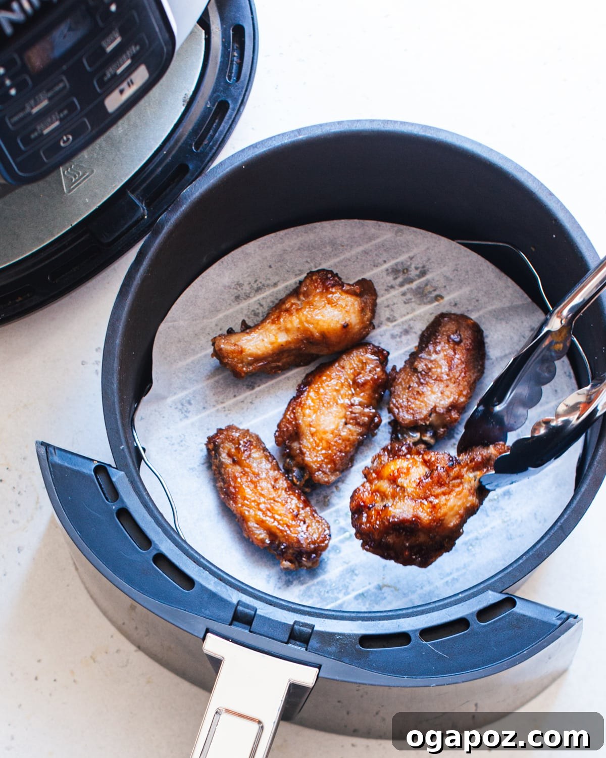 The Ultimate Chicken Wing Sauce Collection 6 Teriyaki chicken wings in a bowl.