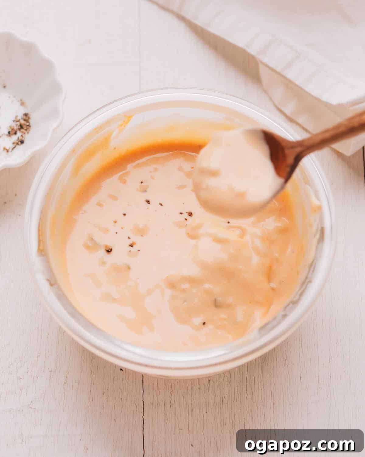 The Ultimate Chicken Wing Sauce Collection 10 Boom Boom Sauce in a small bowl, ready for dipping.