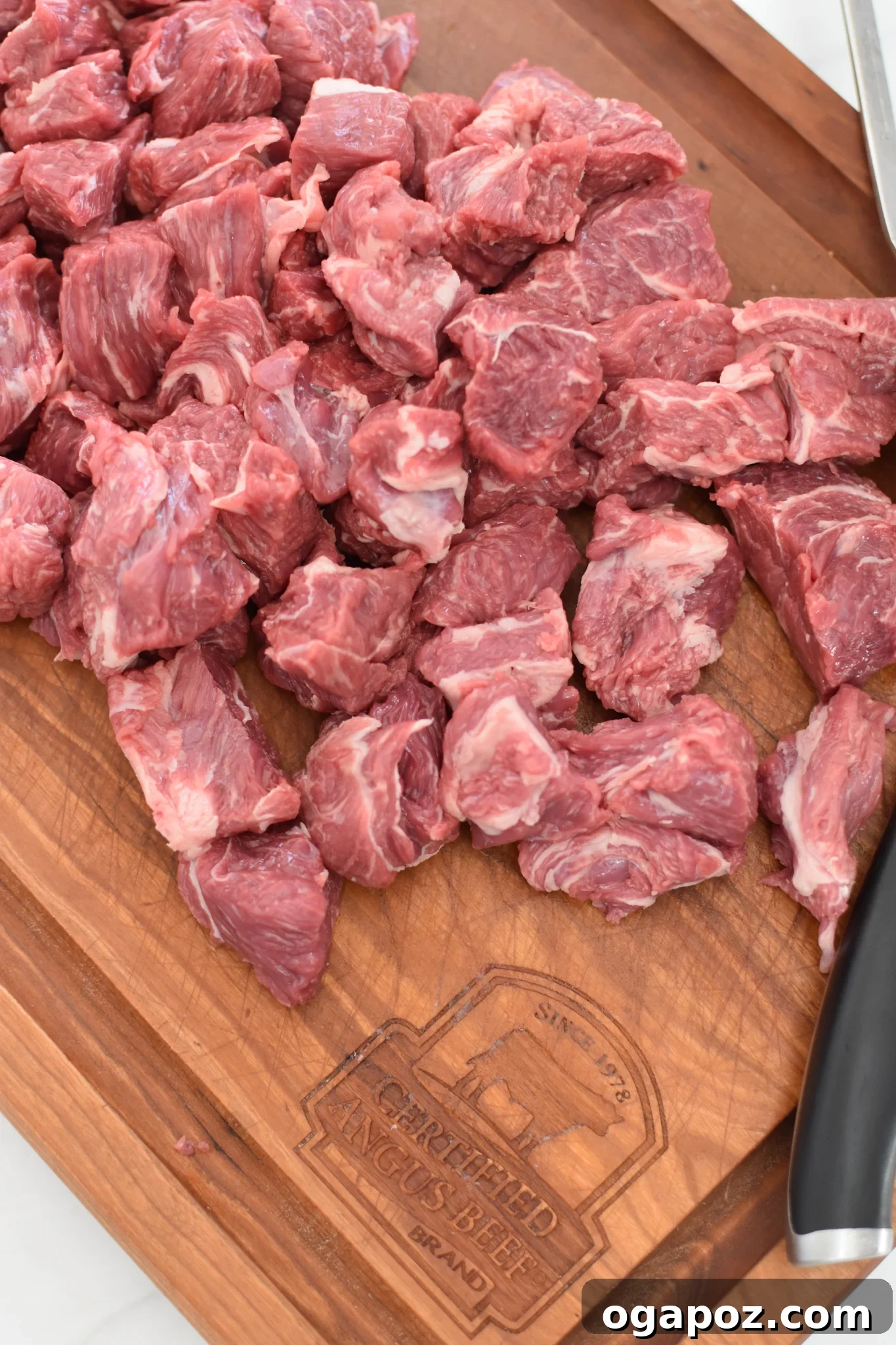 Fall-Apart Slow Cooker Beef Curry 5 Slow Cooker Beef Curry beef on a cutting board.