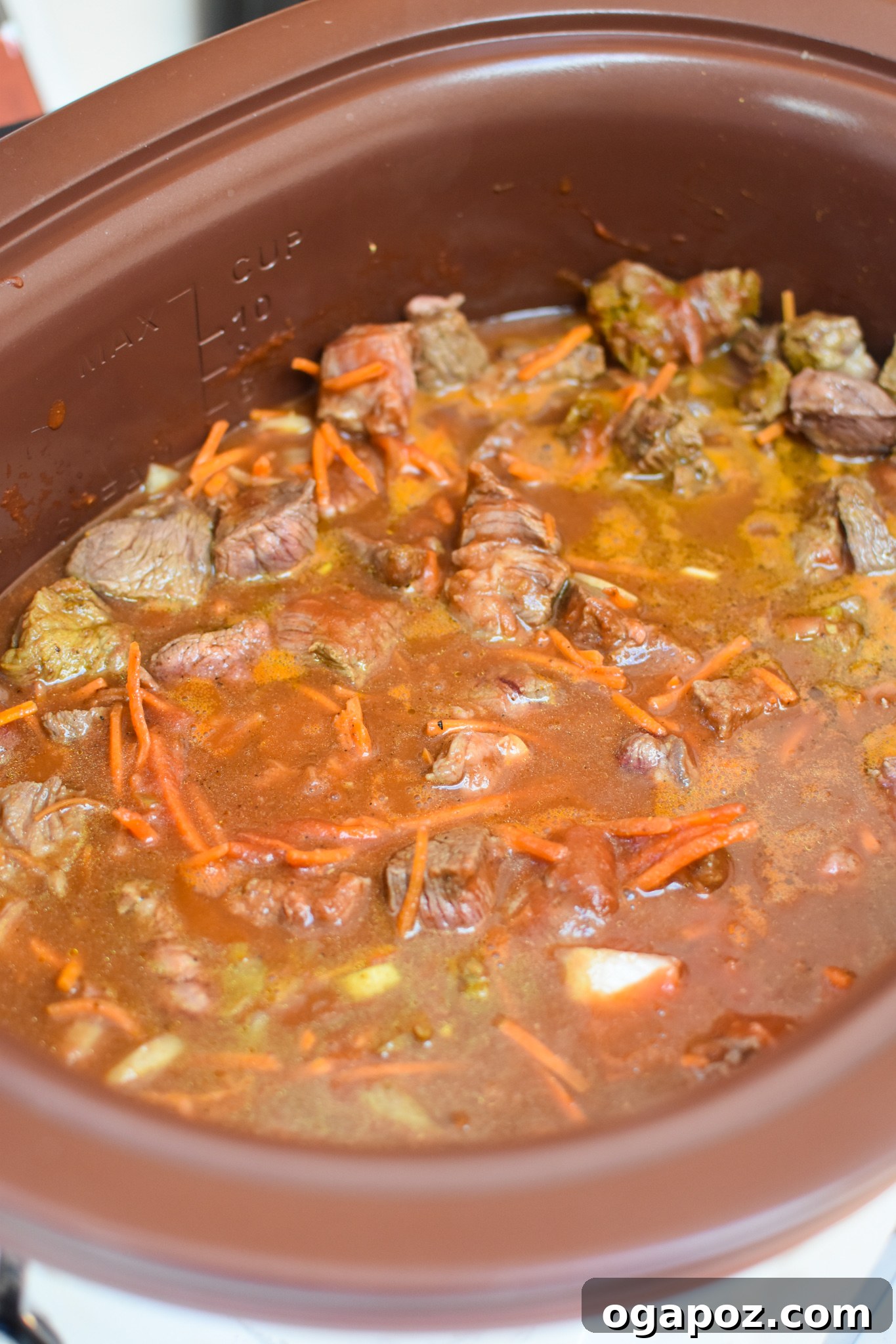 Fall-Apart Slow Cooker Beef Curry 6 Slow Cooker Beef Curry ingredients in a crockpot.