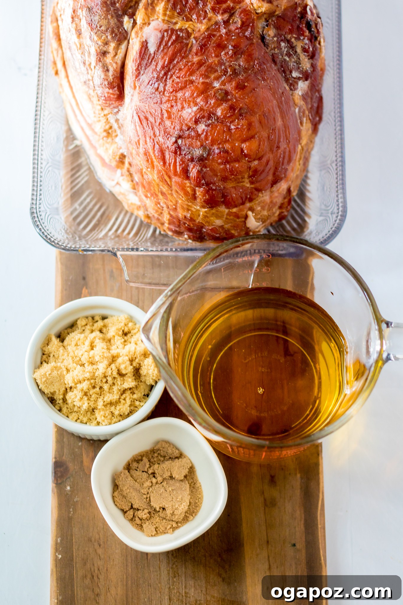 Sweet Apple Cider Glazed Ham 3 Apple Cider Glazed Ham Recipe ingredients laid out on a cutting board.