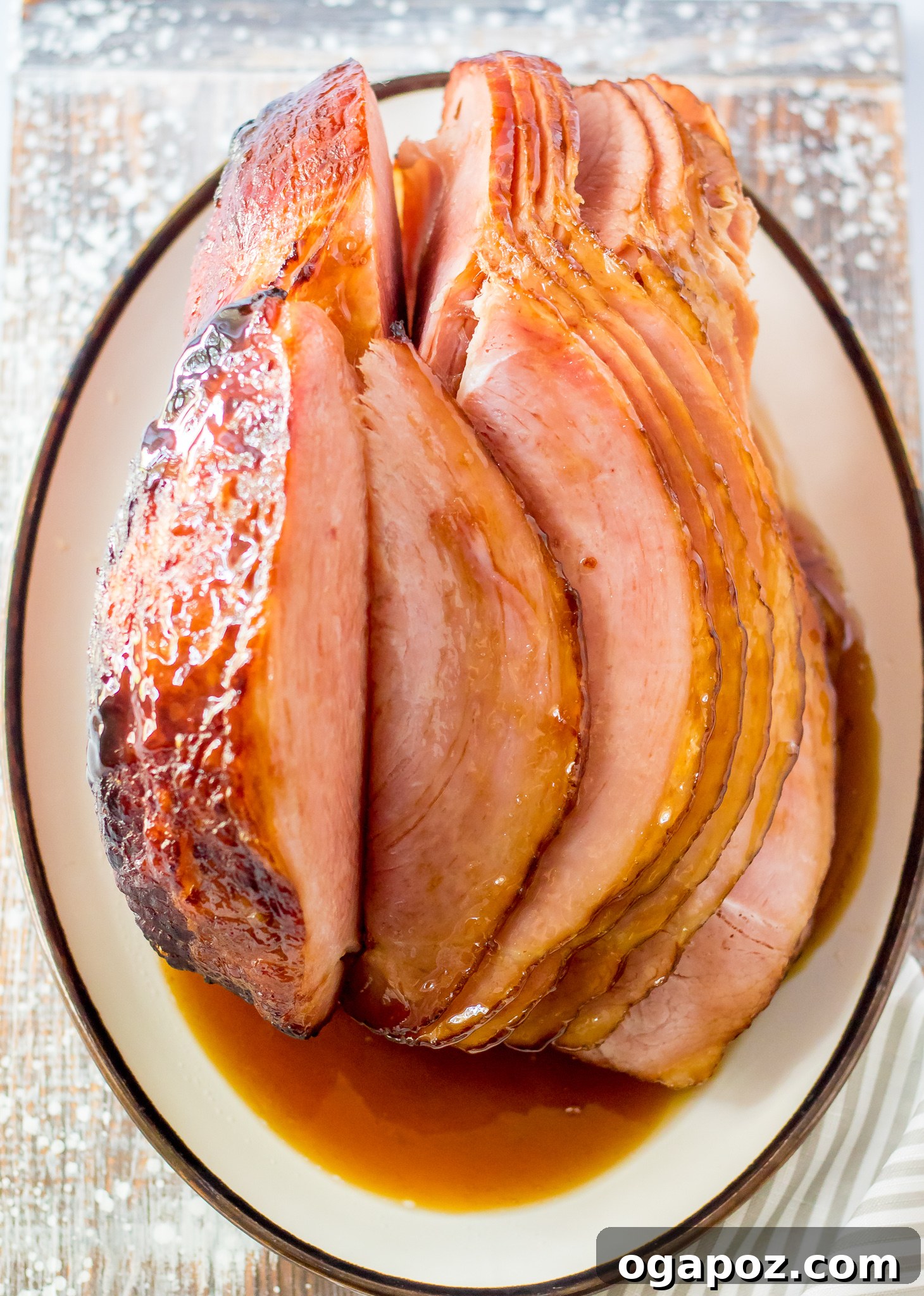 Sweet Apple Cider Glazed Ham 8 Apple Cider Glazed Ham Recipe in a roasting dish, ready for serving.