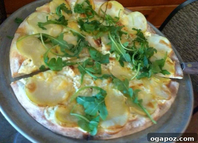 Potato pizza Delicious potato pizza with arugula